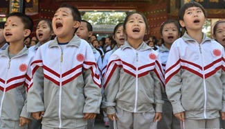 Pupils attend entrance ceremony at Confucian Temple in Beijing