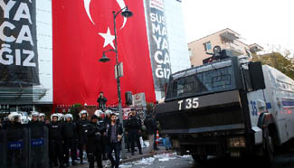 Turkish police storm HQ of media group protesting gov't