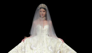 Models present creations at China Fashion Week in Beijing