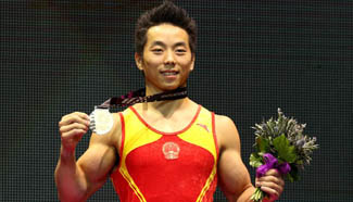 China's You Hao wins men's parallel bars final at gymnastics worlds