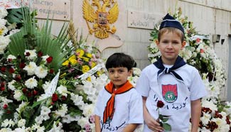 Syrian children visit Russian Embassy to mourn victims of plane crash