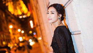 TV host Wen Ya poses for street shots in Paris