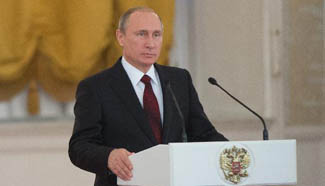 Putin awards foreign citizens national medals in Moscow