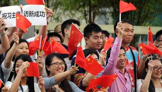 Overseas Chinese wait for President Xi at China Cultural Center in Singapore