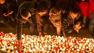 Mourners around the world pay tribute to victims of Paris attacks