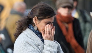 People mourn during one-minute silence for Paris attack victims