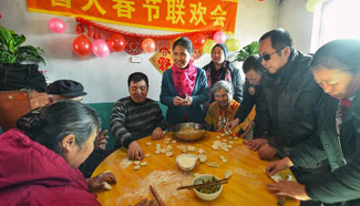 Volunteers, blind people celebrate upcoming Spring Festival in NE China