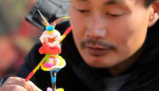 Craftman makes dough Monkey King in E China