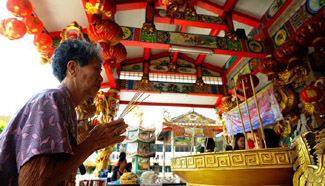 Thai people pray for good fortune during Lunar New Year in Bangkok