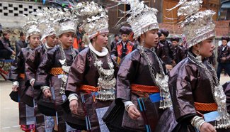 Miao ethnic people dance to celebrate Spring Festival in Guizhou