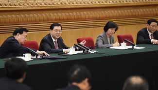 Zhang Dejiang joins group deliberation of NPC deputies from Zhejiang