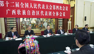 Zhang Gaoli joins group deliberation of NPC deputies from Guangxi