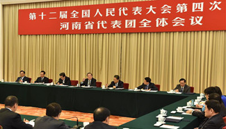 Yu Zhengsheng joins group deliberation of NPC deputies from Henan Province