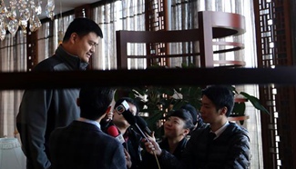 Yao Ming receives interview during break of panel discussion