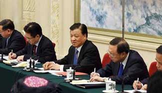 Liu Yunshan joins group deliberation of deputies from Hainan