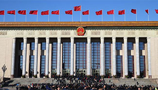 Deputies arrive for 3rd plenary meeting of 4th session of 12th NPC