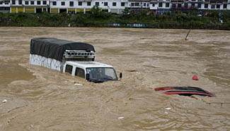 2 killed in SW China by flood-caused torrential rainfall