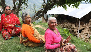 Local villagers reconstruct house damaged by earthquake in Nepal