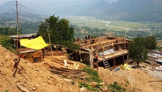 Local villagers reconstruct house after Nepal earthquake