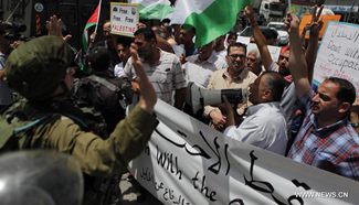 Palestinians mark 49th anniversary of Israeli occupation, press for statehood