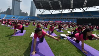 Pregnant women practise yoga for fitness in E China