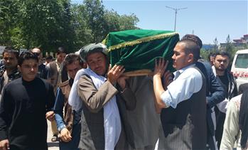People mourn at funeral of translator killed by militants in Kabul