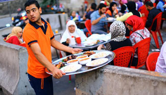 Egyptian people enjoy fast-breaking Iftar meal during Ramadan