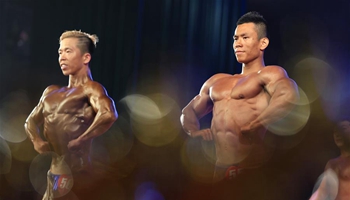 Participants show muscle in east China's bodybuilding festival