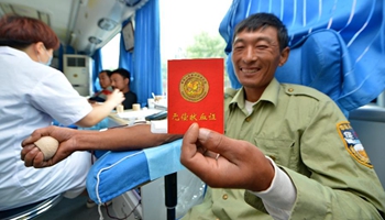 China's volunteers donate blood on World Blood Donor Day