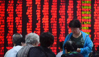 Chinese shares close higher Wednesday