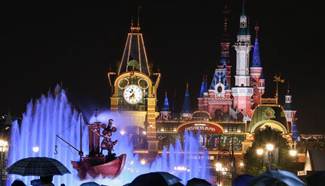 Tourists visit Shanghai Disneyland in evening