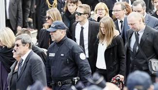 National homage ceremony for police officer stabbed to death held in Paris