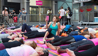 Yoga class held in Times Square to celebrate summer solstice