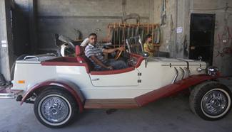 Palestinian adjusts replica of 1927 Mercedes Gazelle in Gaza