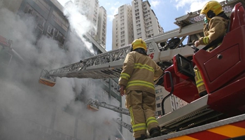 One killed, seven injured at multi-storey building fire in HK