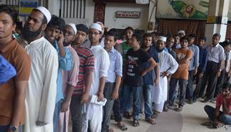 People buy train tickets ahead of Eid-al-Fitr festival in Bangladesh