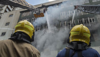 One firefighter killed, seven injured when battling blaze in Hong Kong