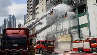 HK's firefighters struggle to contain deadly blaze