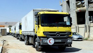 Relief aid enters 2 besieged Syrian areas for first time in 4 years
