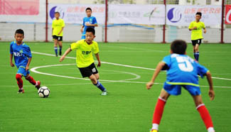 Football camp for primary school students kicks off in China's Qingdao