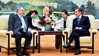 Chinese FM meets Greek counterpart in Beijing