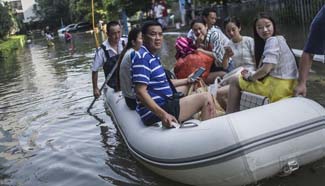 Trapped residents evacuated in waterlogged areas in Wuhan
