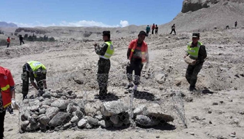 Rescuers repairing roads to landslide-hit Xinjiang village