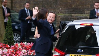 Cameron leaves Downing Street, offers resignation to Queen