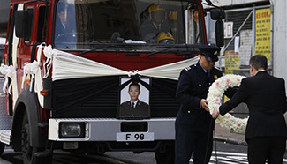 Official funeral held in HK for officer killed in battling fire