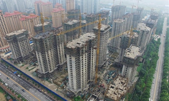China's home price growth moderates in June