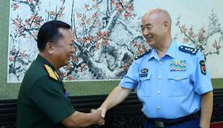 Senior Chinese, Lao military officials meet in Beijing
