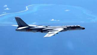 China to make "regular" air combat patrols over South China Sea