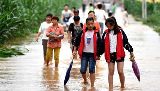 Residents transferred to makeshift shelters due to flood threat in Henan