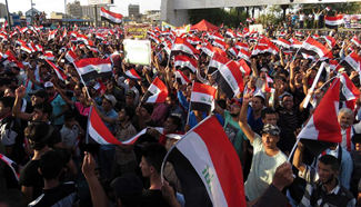 People protest against corruption and sectarianismat in downtown Baghdad, Iraq